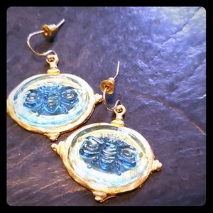 Gold tone and glass earring